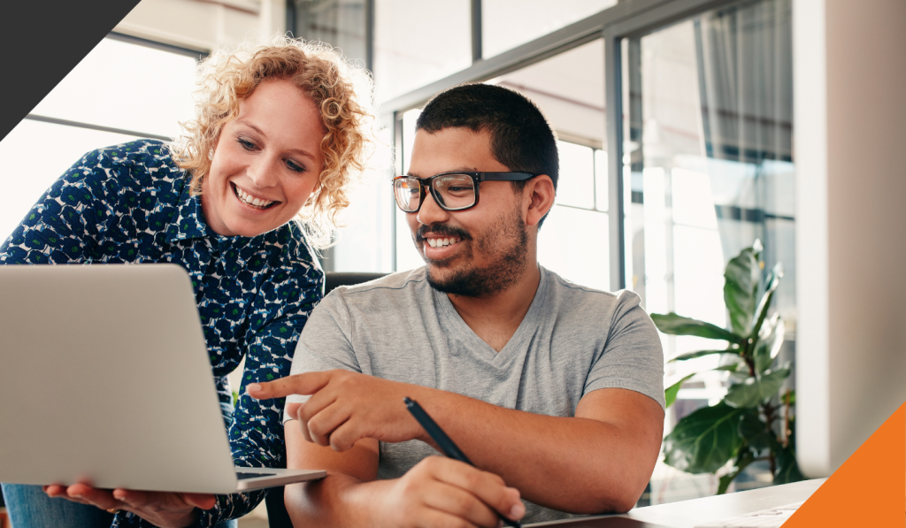 two coworkers reviewing changes and working through work updates demonstrating stress as energy 