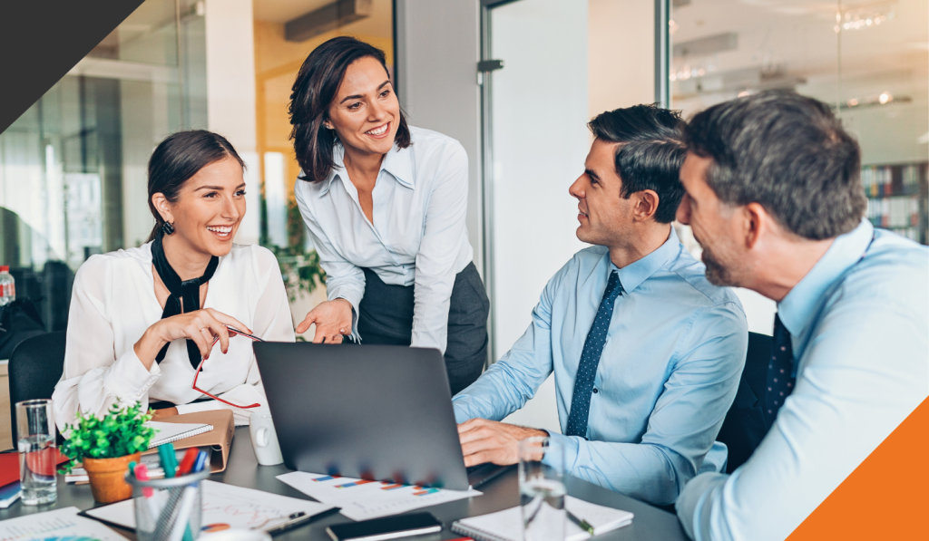 4 employees seated discussing the importance of emotional intelligence in leadership 