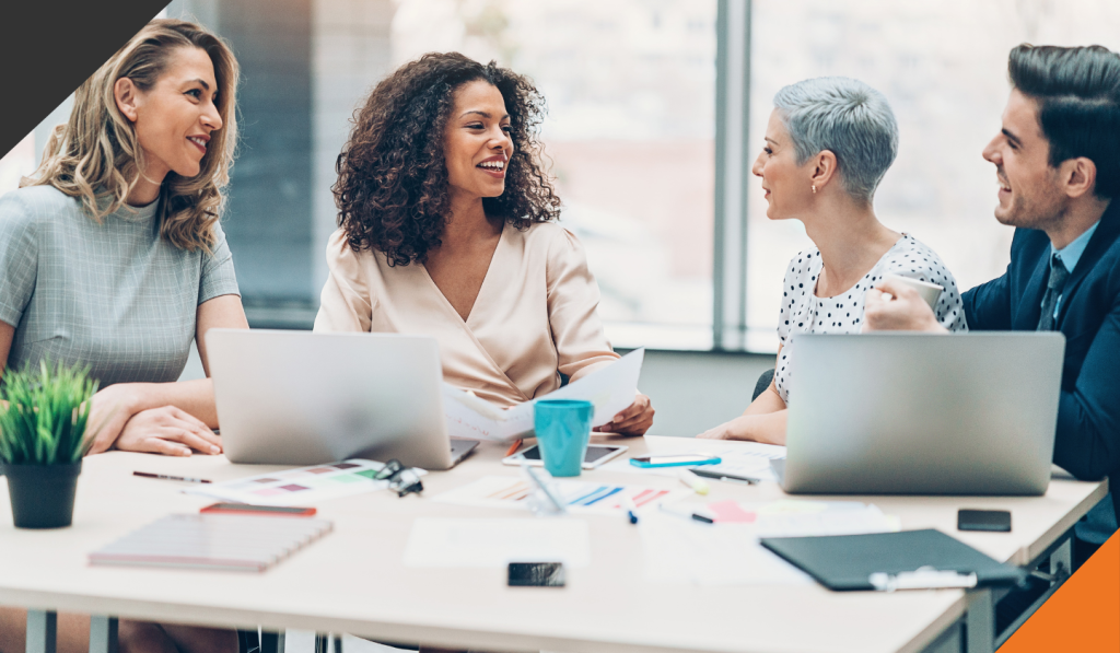 4 people in a meeting discussing change management
