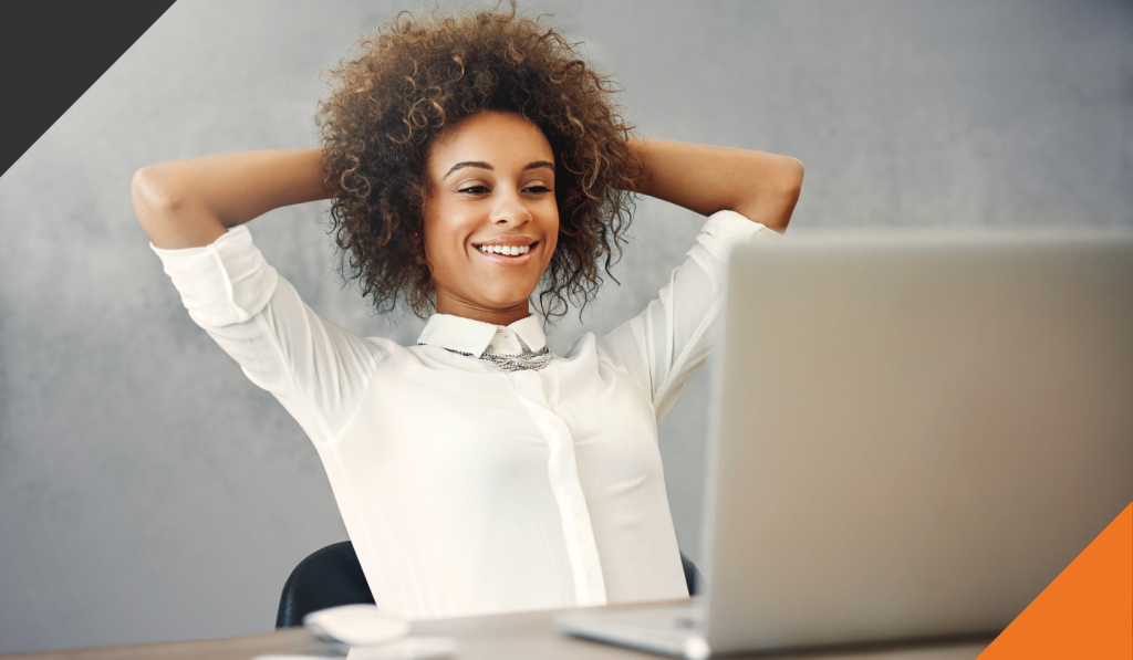 an employee seated at her computer discovering she can get comfortable with the uncomfortable moments of stress