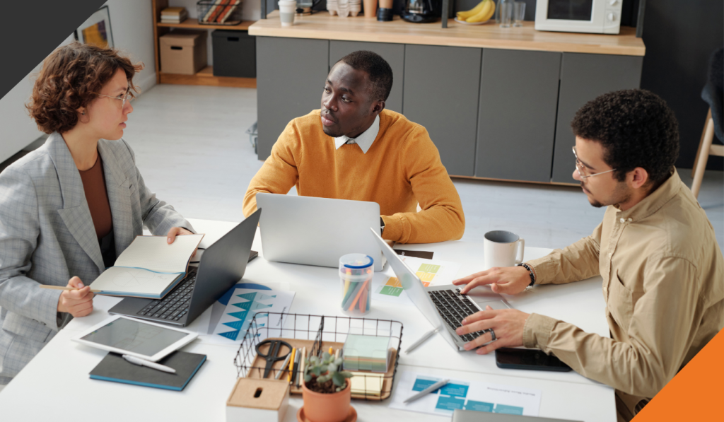 3 team managers conducting year-end planning with team collaboration