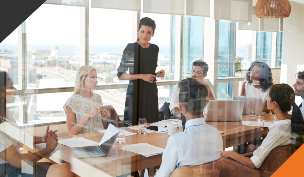 employees gathered in a meeting demonstrating leadership foundations